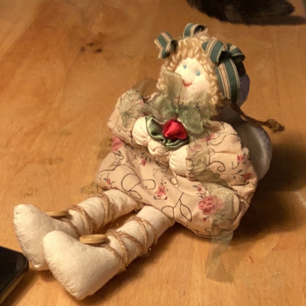 AVAILABLE - A ornament of a lovely curly haired beanie and cloth little girl.